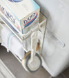 Close up aerial view of white Magnet Laundry Storage Pockets holding laundry items by Yamazaki Home.