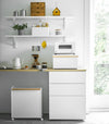 Front view of white Bread Box on kitchen countertop by Yamazaki Home.