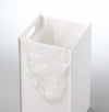 White Grid Panel Accessory - open shelf holding Pantry Organizers over kitchen stovetop by Yamazaki Home.