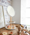 Closed white Undershelf Tablet and Cookbook Holder holding open cookbook by Yamazaki Home.
