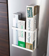Front view of white Magnetic Wrap Holder containing cooking and baking paper by Yamazaki home.