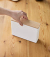 Aerial view of person grabbing Coffee Filter Case's cover by Yamazaki Home.