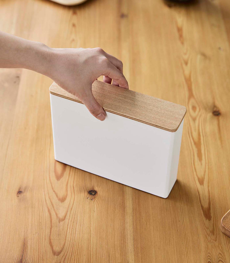 Aerial view of person grabbing Coffee Filter Case's cover by Yamazaki Home.