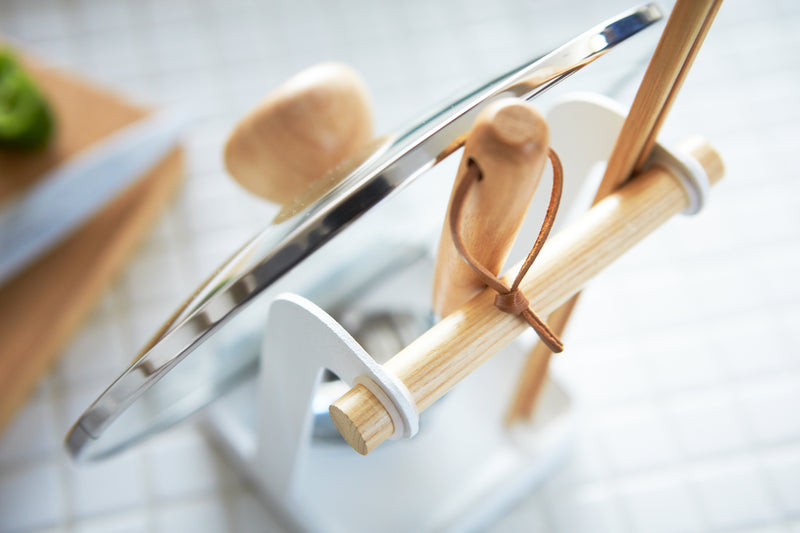 Aerial view of Lid & Ladle Stand holding pot lid and kitchen utensils by Yamazaki Home.